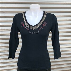 Harley-Davidson black top with chain at neck